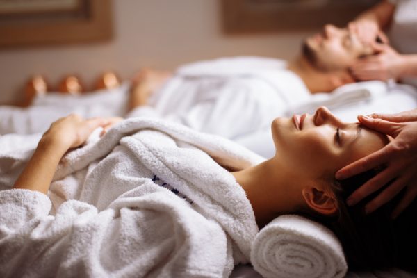 man and woman enjoying relaxation therapy