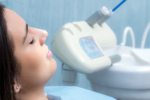 Relaxed young female patient in the dentist's chair