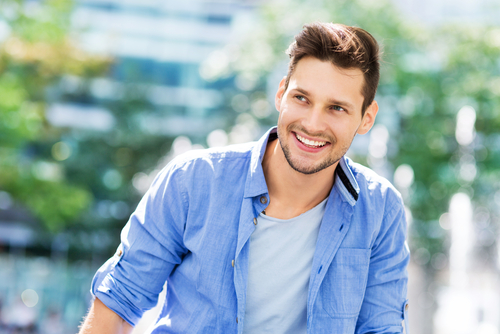 Young man smiling outdoors