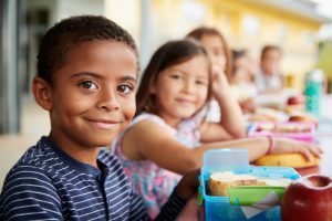 a young man's smile is protected at lunch thanks to dental sealants